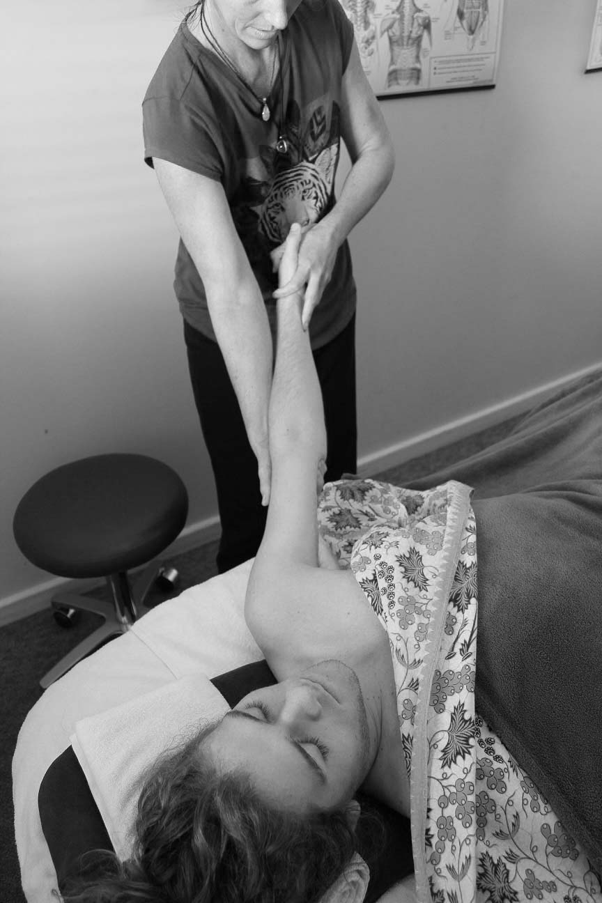 Hannah Wilkins, Fremantle-based remedial massage therapist works with a patient.